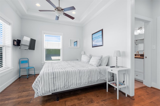 bedroom with wood-type flooring, ornamental molding, baseboards, and recessed lighting