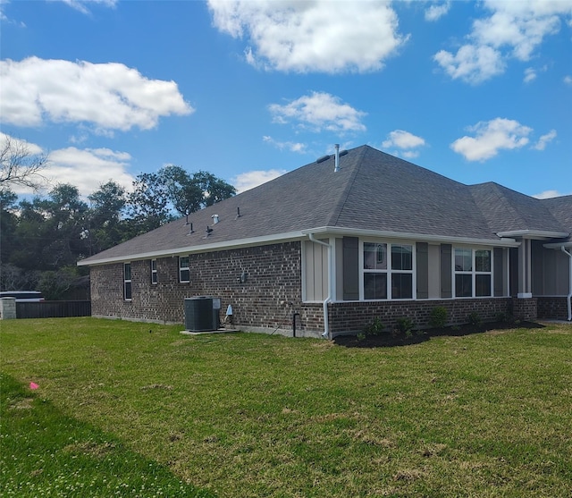 601 Greystone Ln, Angleton, TX 77515 - view of side of property featuring central AC unit, brick siding, and roof with shingles