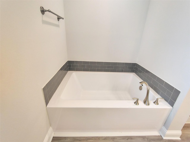 601 Greystone Ln, Angleton, TX 77515 - full bath with a garden tub and wood finished floors