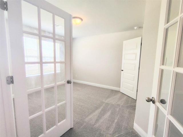 601 Greystone Ln, Angleton, TX 77515 - corridor featuring french doors, carpet floors, and baseboards