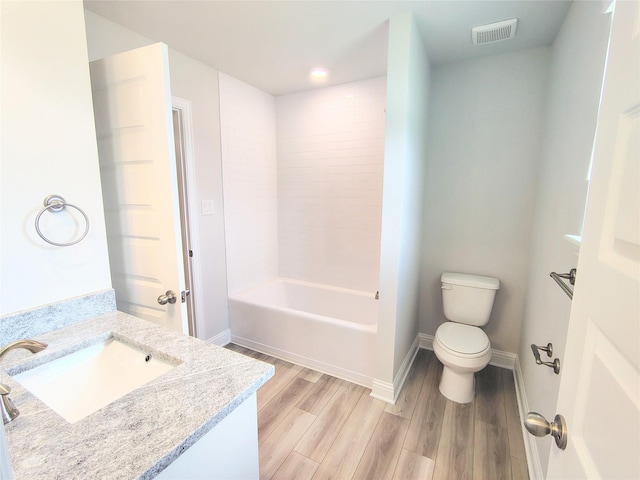 601 Greystone Ln, Angleton, TX 77515 - full bathroom featuring vanity, toilet, wood finished floors, baseboards, and shower / bath combination