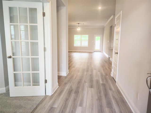 601 Greystone Ln, Angleton, TX 77515 - hallway featuring light wood-style flooring, baseboards, and crown molding
