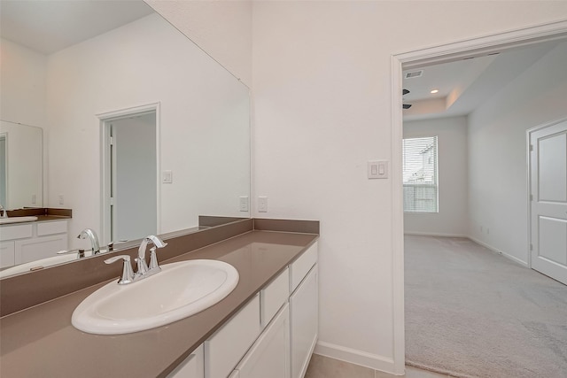 bathroom with recessed lighting, vanity, visible vents, and baseboards