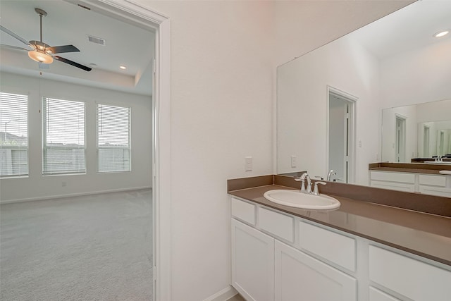 bathroom with ceiling fan, vanity, visible vents, recessed lighting, and baseboards