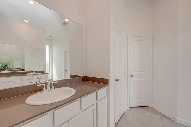 bathroom featuring tile patterned floors, recessed lighting, and vanity