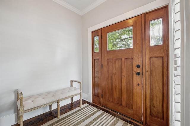 foyer entrance with light wood finished floors, baseboards, and ornamental molding