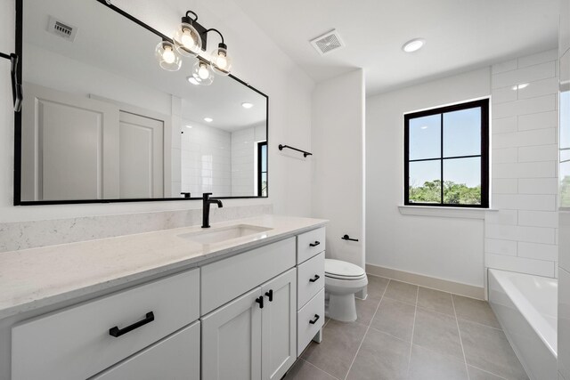 full bathroom featuring vanity, tile patterned flooring, visible vents, toilet, and baseboards
