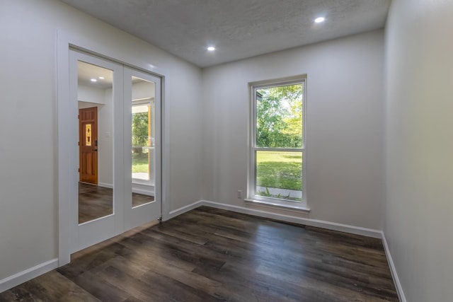 652 E Taylor Lake Cir, Livingston, TX 77351 - spare room with recessed lighting, dark wood-type flooring, french doors, and baseboards