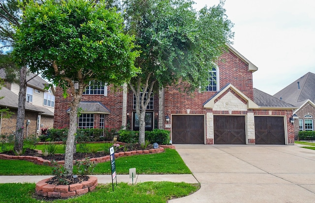 25419 Richton Falls Dr, Richmond, TX 77406 - view of front of property with brick siding, an attached garage, and concrete driveway