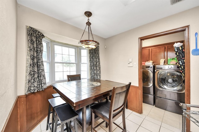13230 Ferry Hill Ln, Houston, TX 77015 - dining area with washing machine and clothes dryer and light tile patterned flooring
