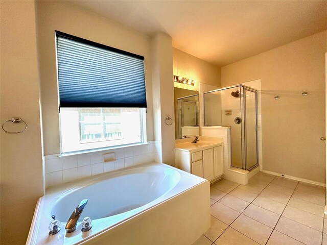 8414 Manassas Ln, Houston, TX 77083 - bathroom with a shower stall, a bath, vanity, and tile patterned floors