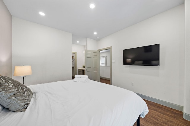 bedroom featuring baseboards, recessed lighting, and wood finished floors