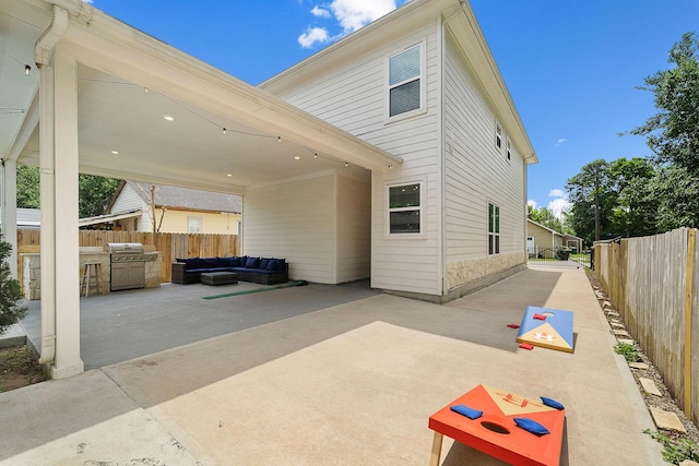 view of patio / terrace featuring outdoor lounge area, a fenced backyard, and a grill