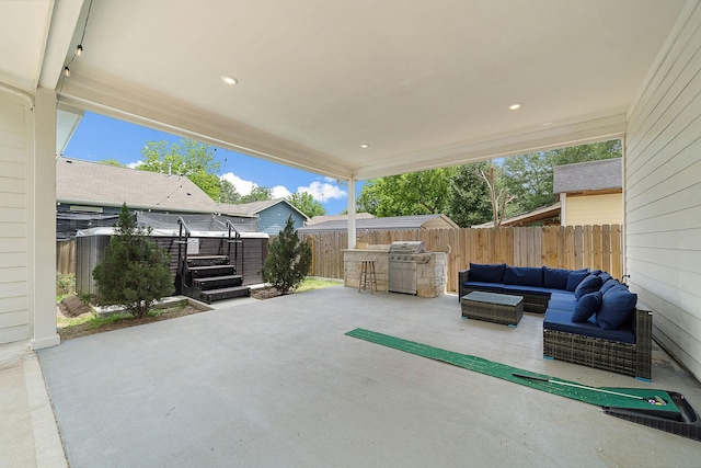 view of patio / terrace featuring grilling area, outdoor lounge area, and a fenced backyard
