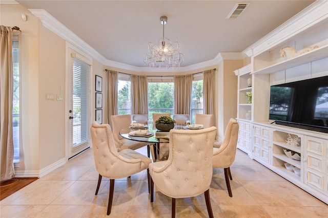 dining space featuring visible vents, ornamental molding, a notable chandelier, and light tile patterned floors