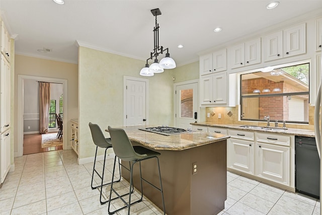 kitchen featuring gas stovetop, white cabinets, black dishwasher, a center island, and a sink
