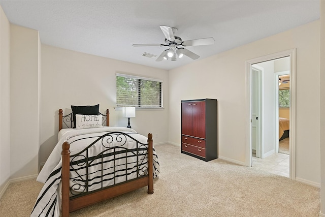 bedroom with carpet, visible vents, and baseboards