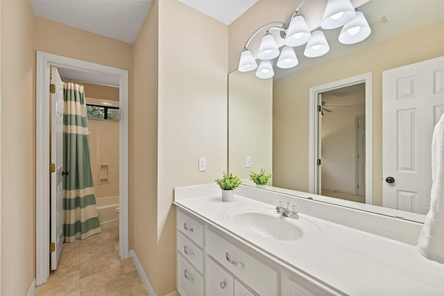full bathroom featuring vanity, baseboards, tile patterned floors, toilet, and shower / bath combo with shower curtain