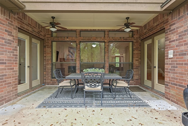 view of patio featuring a ceiling fan and outdoor dining area