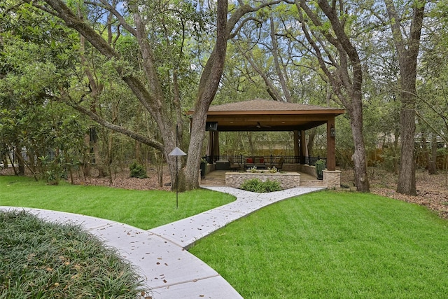 surrounding community with a gazebo and a yard