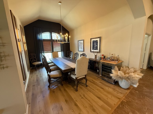 29046 Davenport Dr, Katy, TX 77494 - dining room with an inviting chandelier, wood finished floors, and vaulted ceiling