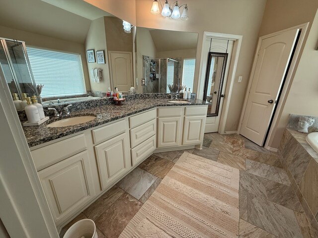 29046 Davenport Dr, Katy, TX 77494 - bathroom featuring a sink, double vanity, a shower stall, and a garden tub
