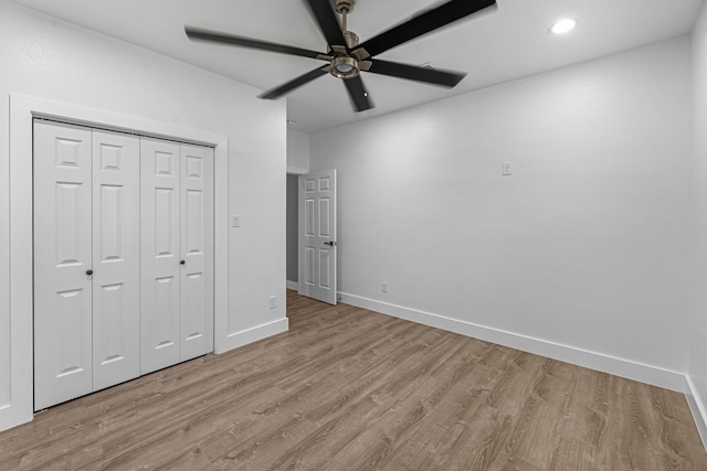 unfurnished bedroom featuring a closet, baseboards, ceiling fan, light wood-type flooring, and recessed lighting