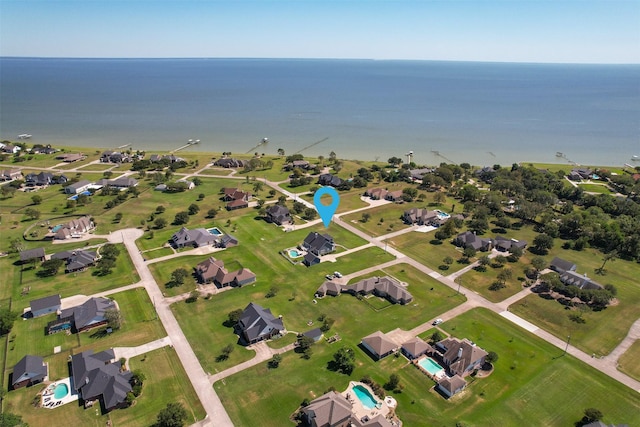 bird's eye view featuring a water view and a residential view