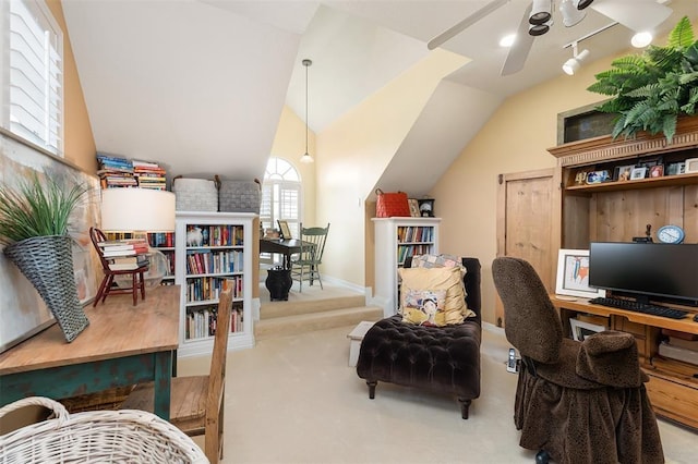 office space featuring ceiling fan, carpet flooring, and vaulted ceiling