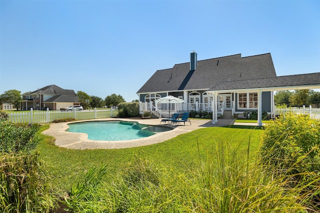 view of swimming pool featuring a patio, a yard, a fenced backyard, and a fenced in pool