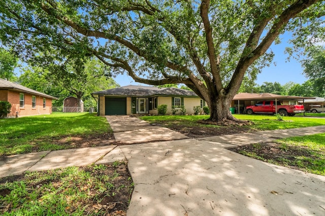 1702 Sheridan Dr, Baytown, TX 77520 - single story home with a garage, driveway, and brick siding
