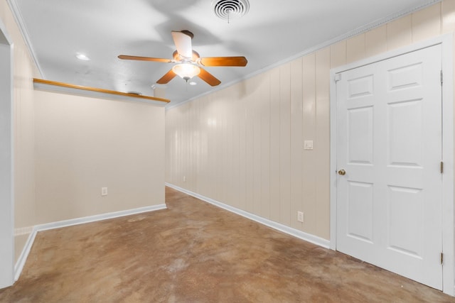 1702 Sheridan Dr, Baytown, TX 77520 - spare room featuring ceiling fan, concrete floors, baseboards, and ornamental molding