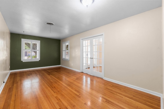 1702 Sheridan Dr, Baytown, TX 77520 - empty room with baseboards and light wood-style flooring