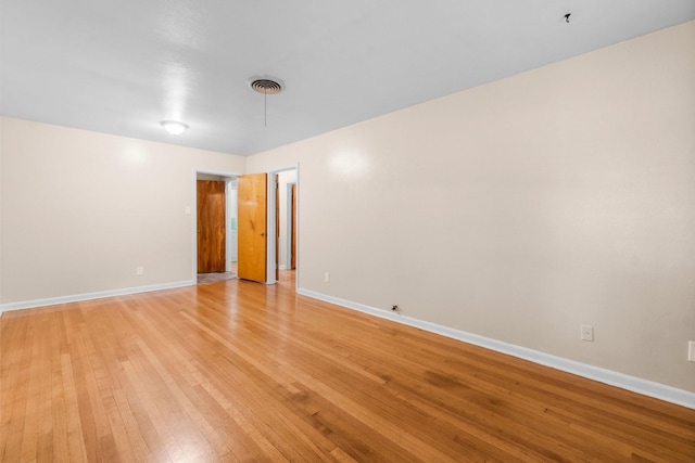1702 Sheridan Dr, Baytown, TX 77520 - empty room with light wood-style floors and baseboards