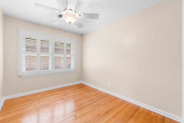 1702 Sheridan Dr, Baytown, TX 77520 - empty room featuring baseboards, light wood-style floors, and a ceiling fan