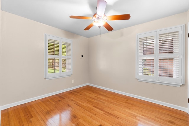 1702 Sheridan Dr, Baytown, TX 77520 - unfurnished room with baseboards, light wood-style floors, and ceiling fan