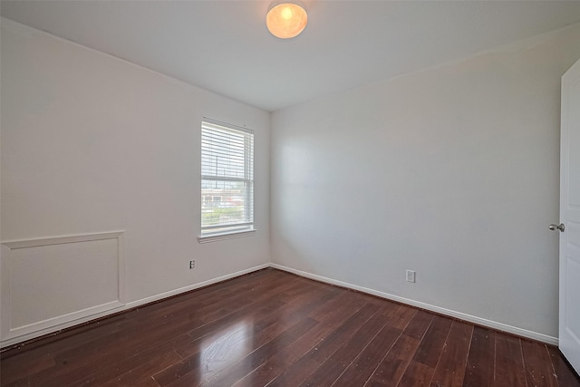 7727 N Friesian Meadow Ln NW, Humble, TX 77338 - empty room with dark wood-style flooring and baseboards