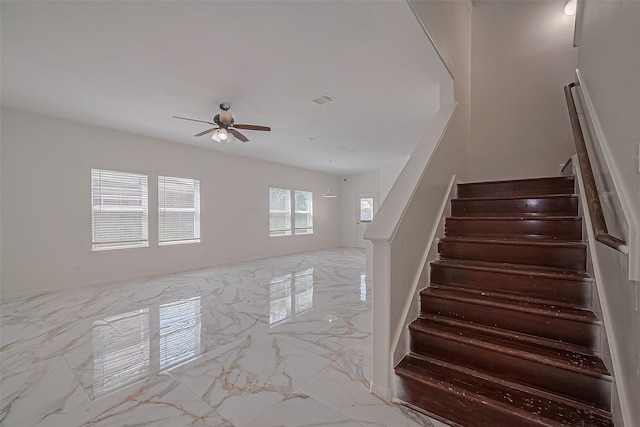 7727 N Friesian Meadow Ln NW, Humble, TX 77338 - stairs with marble finish floors and ceiling fan