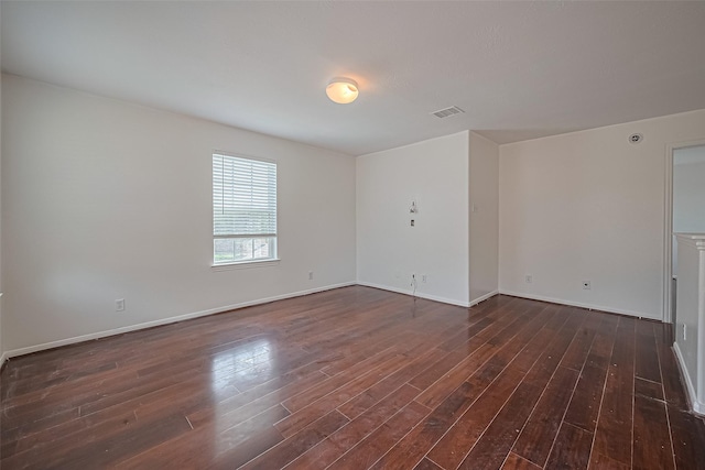 7727 N Friesian Meadow Ln NW, Humble, TX 77338 - unfurnished room with dark wood-style flooring and baseboards