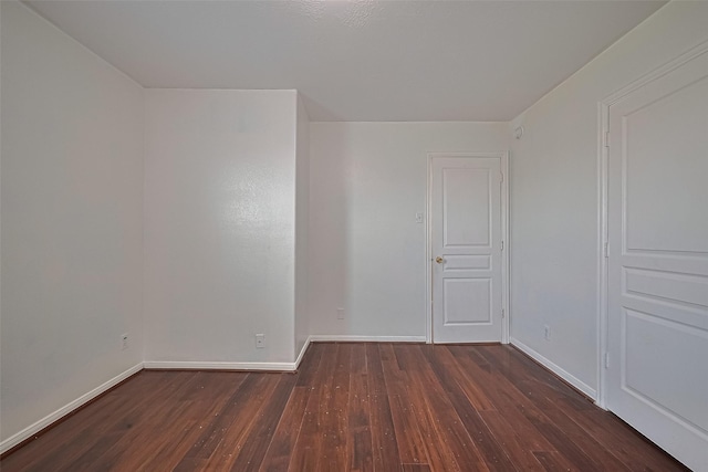 7727 N Friesian Meadow Ln NW, Humble, TX 77338 - spare room featuring wood finished floors and baseboards