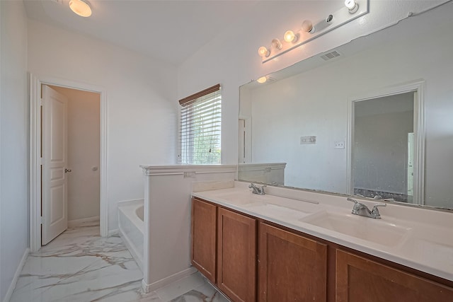 7727 N Friesian Meadow Ln NW, Humble, TX 77338 - bathroom featuring marble look tiles, a garden tub, and double vanity