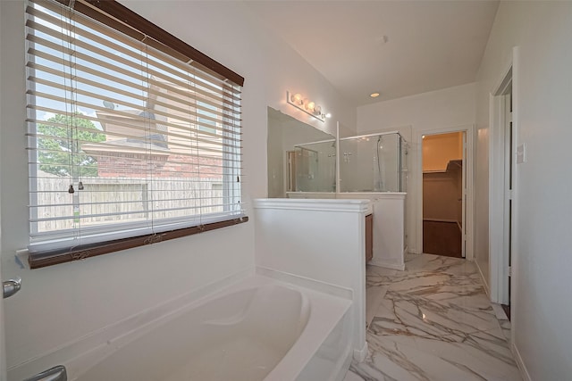 7727 N Friesian Meadow Ln NW, Humble, TX 77338 - bathroom featuring a bath, a stall shower, a spacious closet, and plenty of natural light