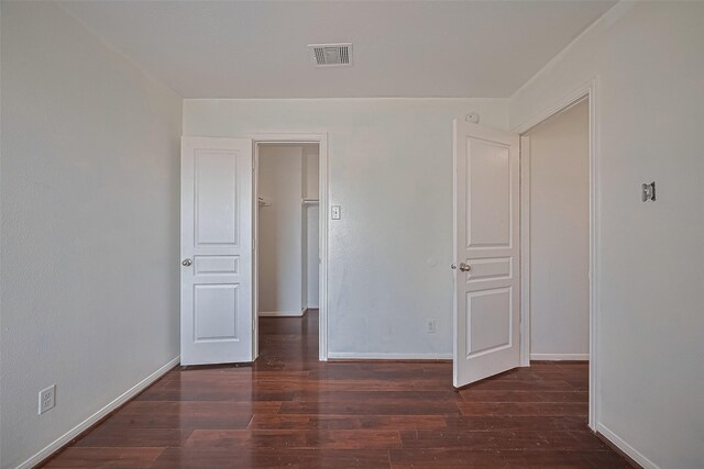 7727 N Friesian Meadow Ln NW, Humble, TX 77338 - empty room with wood finished floors and baseboards