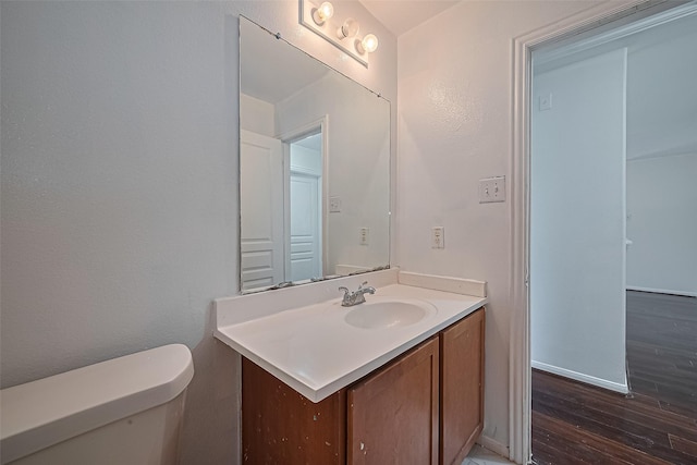 7727 N Friesian Meadow Ln NW, Humble, TX 77338 - half bathroom with vanity and wood finished floors