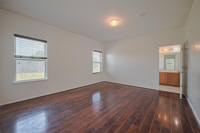 7727 N Friesian Meadow Ln NW, Humble, TX 77338 - unfurnished room with plenty of natural light and dark wood finished floors