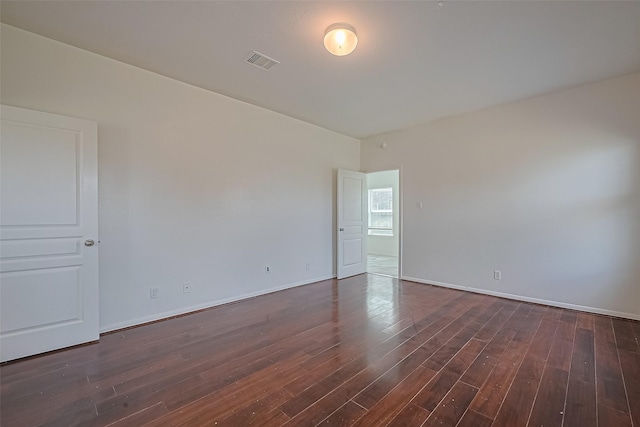 7727 N Friesian Meadow Ln NW, Humble, TX 77338 - spare room with dark wood-style flooring and baseboards