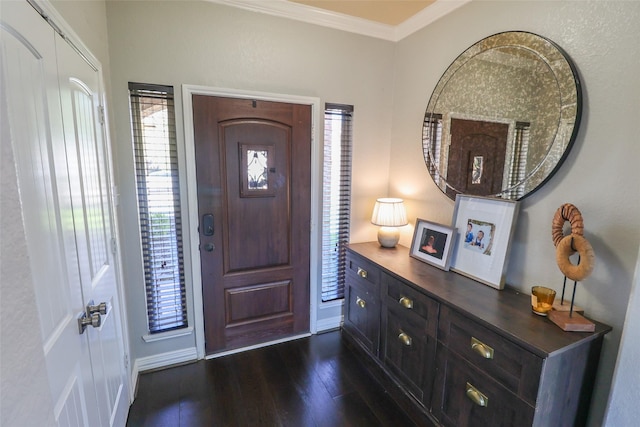 foyer featuring crown molding and dark wood-style floors