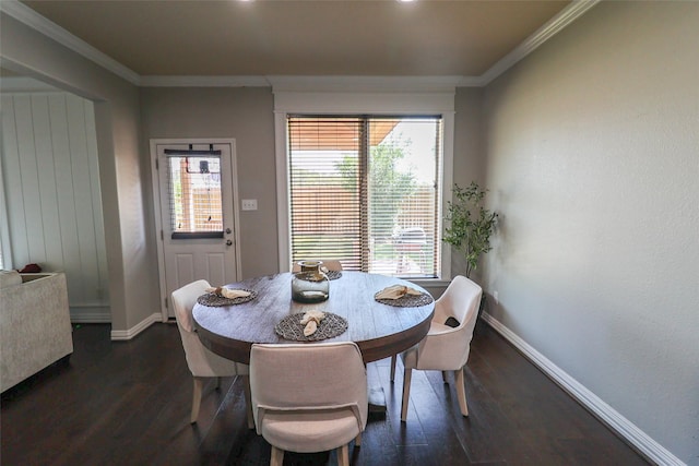 dining area featuring baseboards, dark wood-style floors, and crown molding
