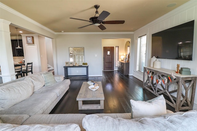 living room with baseboards, a ceiling fan, stairs, crown molding, and hardwood / wood-style flooring
