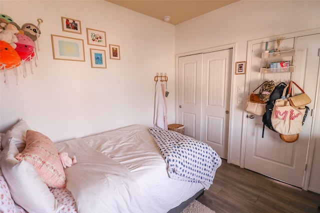 bedroom featuring dark wood-style floors
